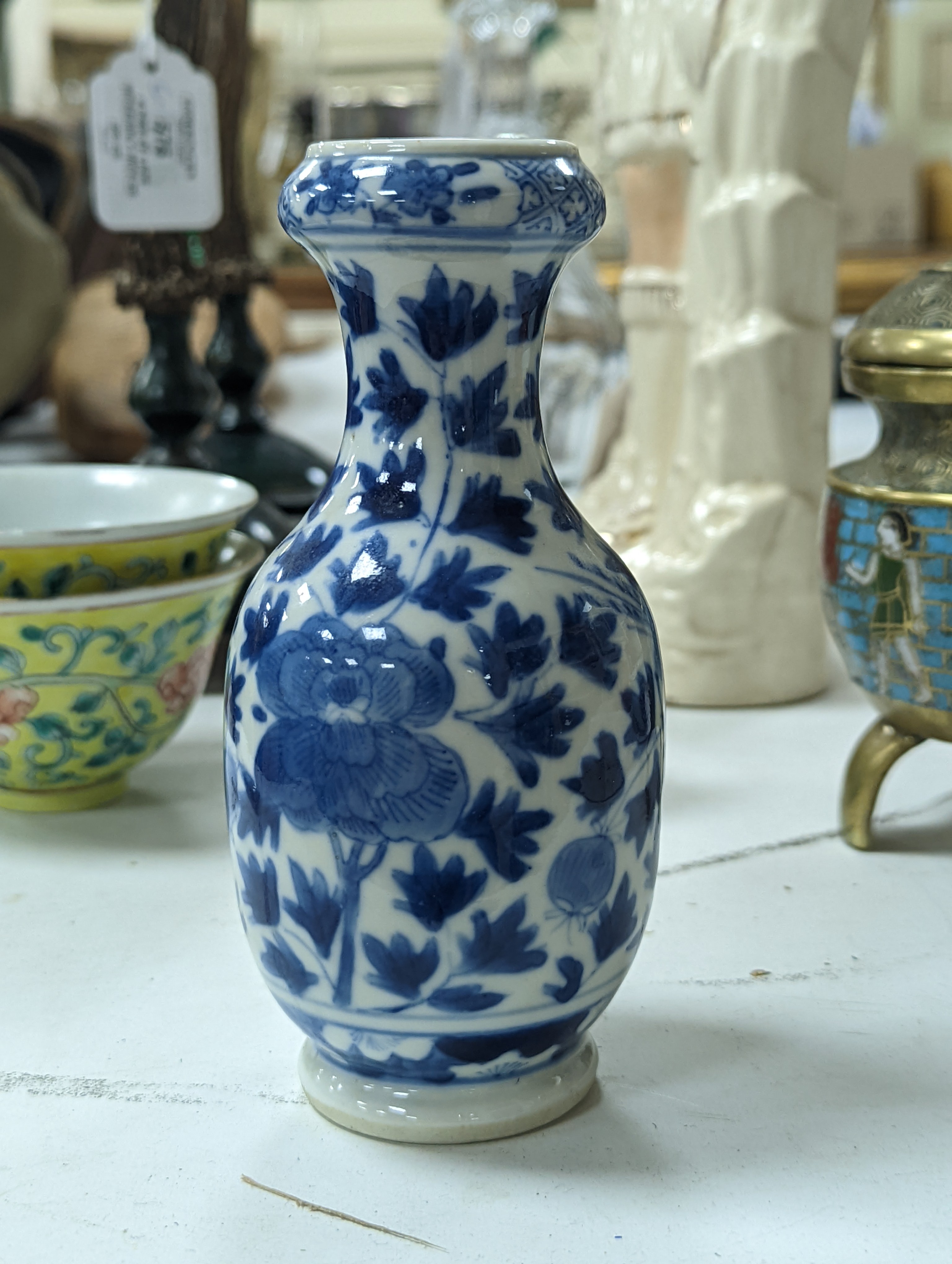 A group of Chinese porcelain, 19th /20th century, to include a pair of yellow ground bowls, 10.8 cm diameter, a blue and white vase, Xuande mark, a similar bowl and vase, and a champleve enamel bronze koro and cover